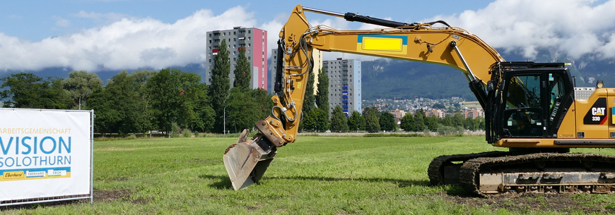 Bagger beim Spatenstich